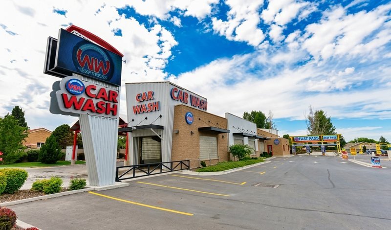The WaterWorks Express car wash on 9000 South in West Jordan, with its lit CAR WASH signs and the WW Express roundel.